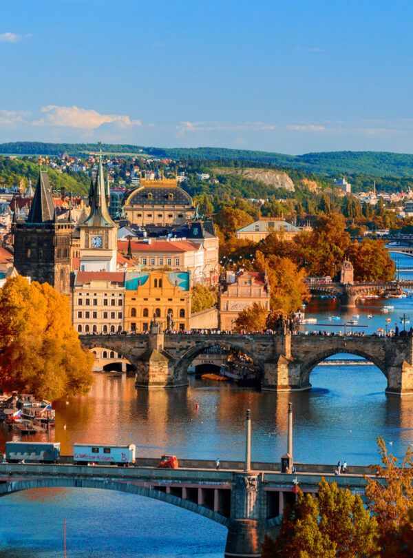 Vltava River and Charle bridge with red foliage