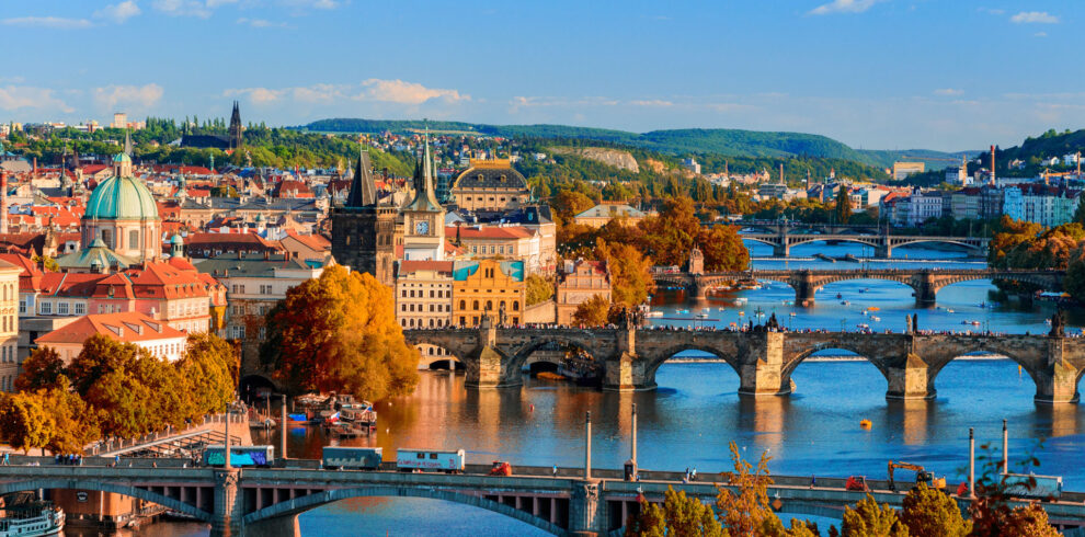 Vltava River and Charle bridge with red foliage